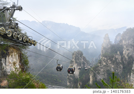 The cabs of the funicular descend past the columns of the Tianmenshan Mountains in China The cabs of the funicular descend past the columns of the Tianmenshan Mountains in China 140176383