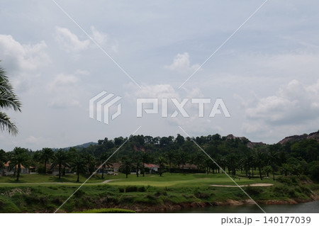 Tropical Palm Plantation Landscape in Thailand with Green Hills Tropical Palm Plantation Landscape in Thailand with Green Hills 140177039