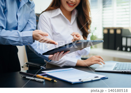 Team work process. Photo young business crew working with new startup project. Project managers meeting. Analyze plans, papers in office Team work process. Photo young business crew working with new startup project. Project managers meeting. Analyze plans, papers in office 140180518
