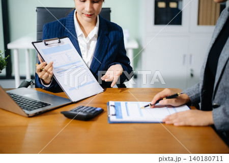 Team work process. Photo young business crew working with new startup project. Project managers meeting. Analyze plans, papers. Team work process. Photo young business crew working with new startup project. Project managers meeting. Analyze plans, papers. 140180711