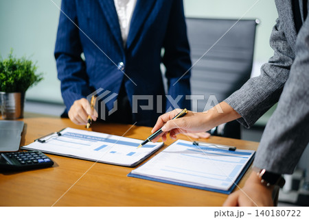 Team work process. Photo young business crew working with new startup project. Project managers meeting. Analyze plans, papers. 140180722