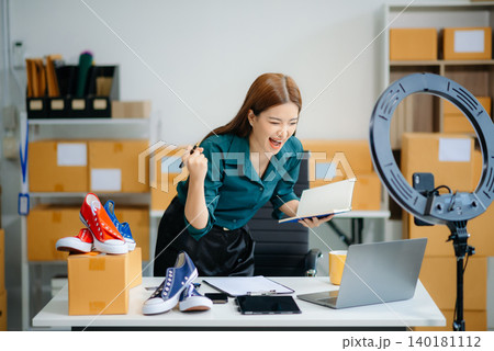 Businesswoman preparing product shipments. Highlighting creativity, entrepreneurship, and the small business journey 140181112