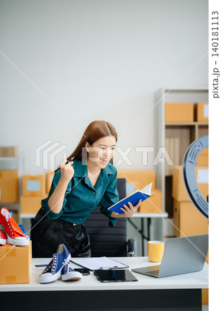 Businesswoman preparing product shipments. Highlighting creativity, entrepreneurship, and the small business journey 140181113