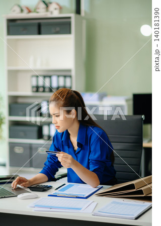 woman feeling migraine head strain.Overworked businesswoman financier while working on laptop and tablet woman feeling migraine head strain.Overworked businesswoman financier while working on laptop and tablet 140181390