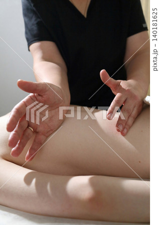 SPA salon and massage. Massage room. A massage therapist is working with a young woman. SPA salon and massage. Massage room. A massage therapist is working with a young woman. 140181625