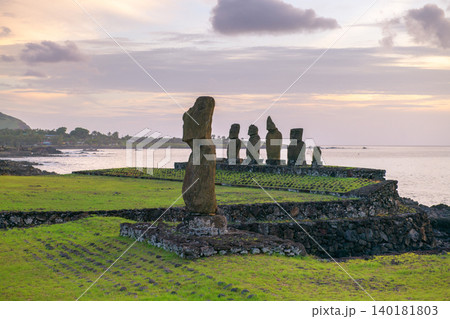 Stoic peaceful moai statue at sunset on easter island chile coast 140181803