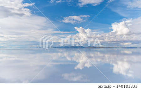 Serene sky cloud reflection on Uyuni salt flat mirror in Bolivia Serene sky cloud reflection on Uyuni salt flat mirror in Bolivia 140181833