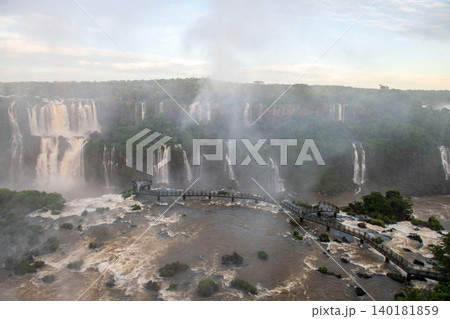 Majestic iguazu falls pouring powerful water and mist across scenic landscape 140181859