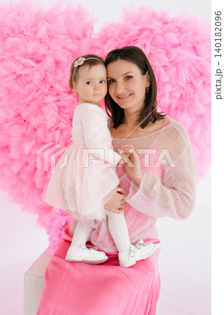 Mother and Little Daughter Looking at Camera 140182096
