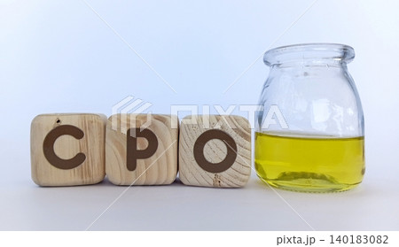 CPO crude palm oil and cooking oil in glass containers. Palm oil news concept 140183082