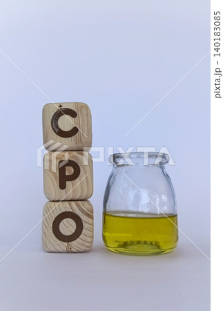 CPO crude palm oil and cooking oil in glass containers. Palm oil news concept CPO crude palm oil and cooking oil in glass containers. Palm oil news concept 140183085