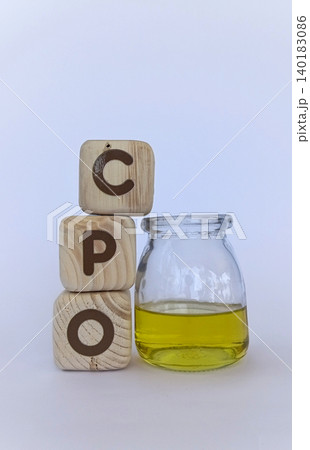 CPO crude palm oil and cooking oil in glass containers. Palm oil news concept CPO crude palm oil and cooking oil in glass containers. Palm oil news concept 140183086
