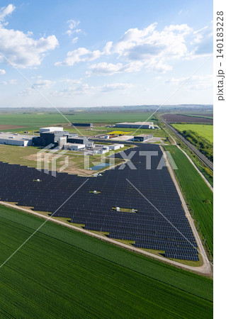 Modern green factory powered by renewable energy. Sustainable development in industry. 140183228