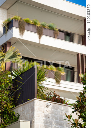 Building exterior with plants on the facade 140183270