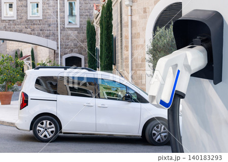 Electric delivery van with electric vehicles charging station. 140183293
