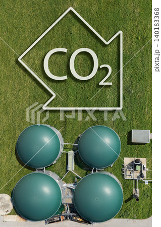 Biogas plant with CO2 emission reduction symbol. Decarbonization and carbon neutrality concept Biogas plant with CO2 emission reduction symbol. Decarbonization and carbon neutrality concept 140183368