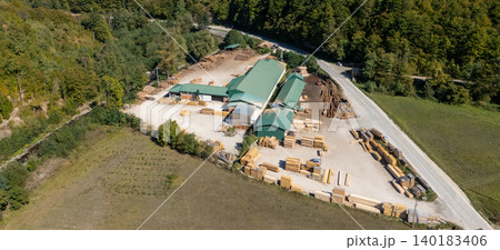 Aerial view of a sawmill factory in the mountains Aerial view of a sawmill factory in the mountains 140183406