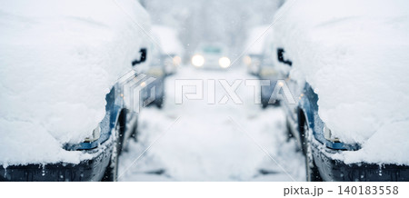 Parked car covered with snow during snow storm Parked car covered with snow during snow storm 140183558