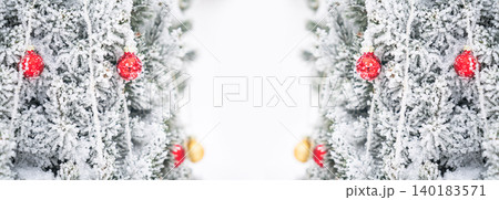Christmas tree with decorative balls covered with snow Christmas tree with decorative balls covered with snow 140183571