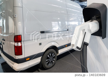 Electric delivery van with electric vehicles charging station.. Electric delivery van with electric vehicles charging station.. 140183609