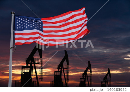 USA flag with oil rigs in the background USA flag with oil rigs in the background 140183932