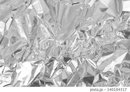 Silver foil leaf shiny texture, abstract grey wrapping paper for background and design art work. Silver foil leaf shiny texture, abstract grey wrapping paper for background and design art work. 140184317