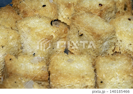 Close up of cubed fried bread croutons freshly made for soup 140185466