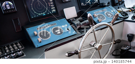 Digital dashboard with navigation monitor system, radar and VHF Radio in ship captain bridge 140185744