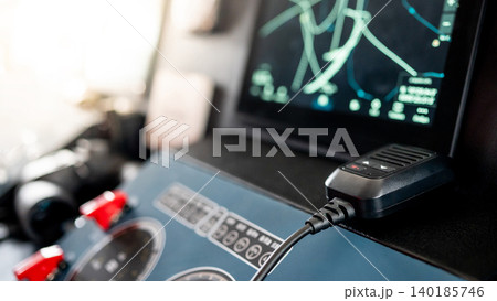Digital GPS navigation monitor screen with VHF Radio and marine radar on boat dashboard 140185746