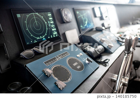 Digital dashboard with navigation monitor system, marine radar and VHF Radio in ship captain bridge 140185750