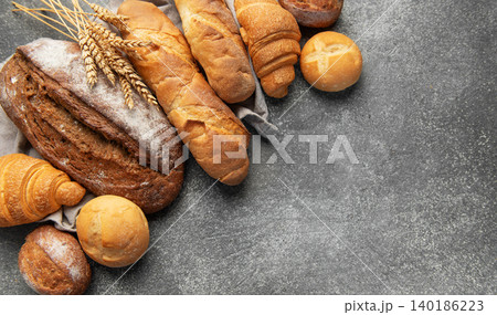 Fresh baked bread, baguettes, croissants, and buns assortment Fresh baked bread, baguettes, croissants, and buns assortment 140186223