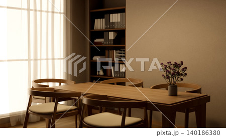 Wooden table with flower pot and chairs beside bookshelf and sunlight through curtain in living room Wooden table with flower pot and chairs beside bookshelf and sunlight through curtain in living room 140186380