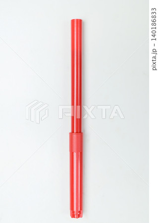 Single red plastic telescopic tube or stick component isolated on a clean white background. Perfect for industrial, toy, medical, or stationery design concepts 140186833