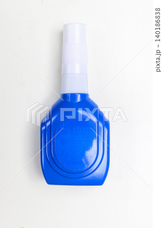 A small blue plastic bottle of instant super glue with a white cap, isolated on a clean white background. Perfect for stationary, DIY, or repair concepts A small blue plastic bottle of instant super glue with a white cap, isolated on a clean white background. Perfect for stationary, DIY, or repair concepts 140186838