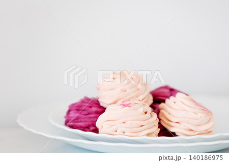 blackcurrant and apple zephyr on white plate blackcurrant and apple zephyr on white plate 140186975