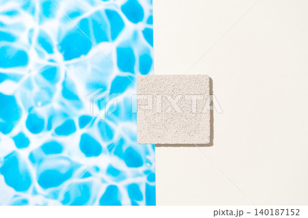Flat lay composition combining vibrant blue swimming pool water ripple texture background Flat lay composition combining vibrant blue swimming pool water ripple texture background 140187152