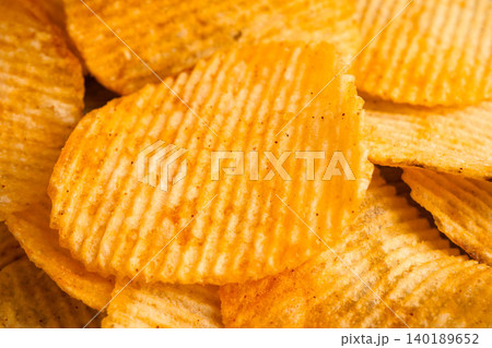 Potato chips , delicious BBQ seasoning spicy for crips, thin slice deep fried snack fast food. Potato chips , delicious BBQ seasoning spicy for crips, thin slice deep fried snack fast food. 140189652