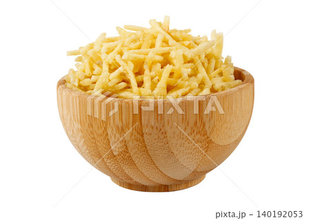 French fries, sticks potato, served in a rustic wooden bowl isolated on a white background 140192053