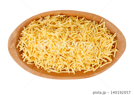 French fries, sticks potato, served in a rustic wooden bowl isolated on a white background French fries, sticks potato, served in a rustic wooden bowl isolated on a white background 140192057