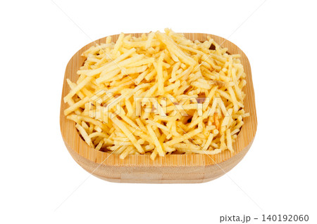 French fries, sticks potato, served in a rustic wooden bowl isolated on a white background 140192060