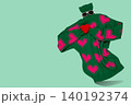 Funny invisible character concept with green knitted turtleneck sweater holding red heart and wearing sunglasses, levitating on green background. 140192374