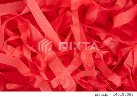 Red paper strips scattered on the surface for decoration or crafts Red paper strips scattered on the surface for decoration or crafts 140193089