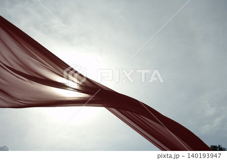 Red Color Cloth Flying In Wind 140193947