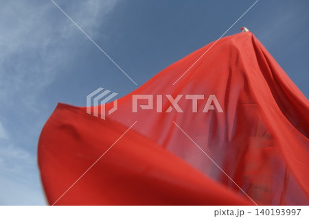 Red Color Cloth Flying In Wind 140193997