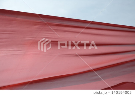 Red Color Cloth Flying In Wind 140194003