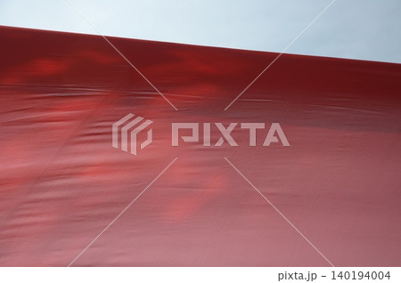 Red Color Cloth Flying In Wind Red Color Cloth Flying In Wind 140194004