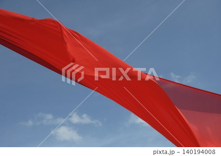 Red Color Cloth Flying In Wind 140194008