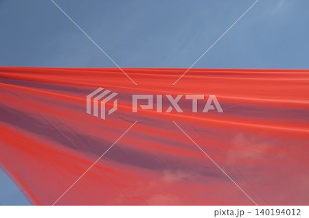 Red Color Cloth Flying In Wind Red Color Cloth Flying In Wind 140194012