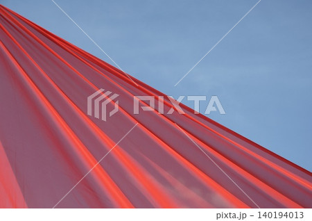 Red Color Cloth Flying In Wind 140194013