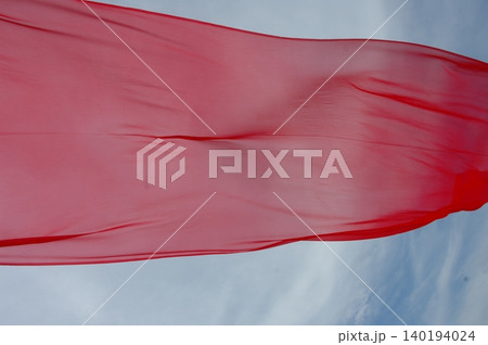 Red Color Cloth Flying In Wind 140194024